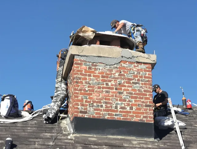 Bell Gardens Chimney Sweep installing a custom chimney crown in Bell Gardens, CA