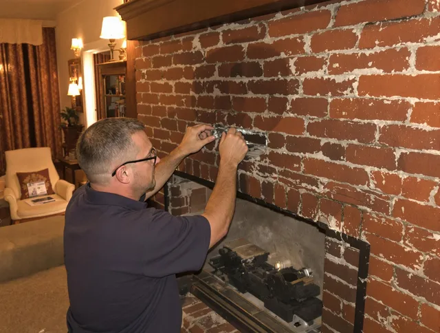 Bell Gardens Chimney Sweep expert fixing a fireplace in Bell Gardens, CA